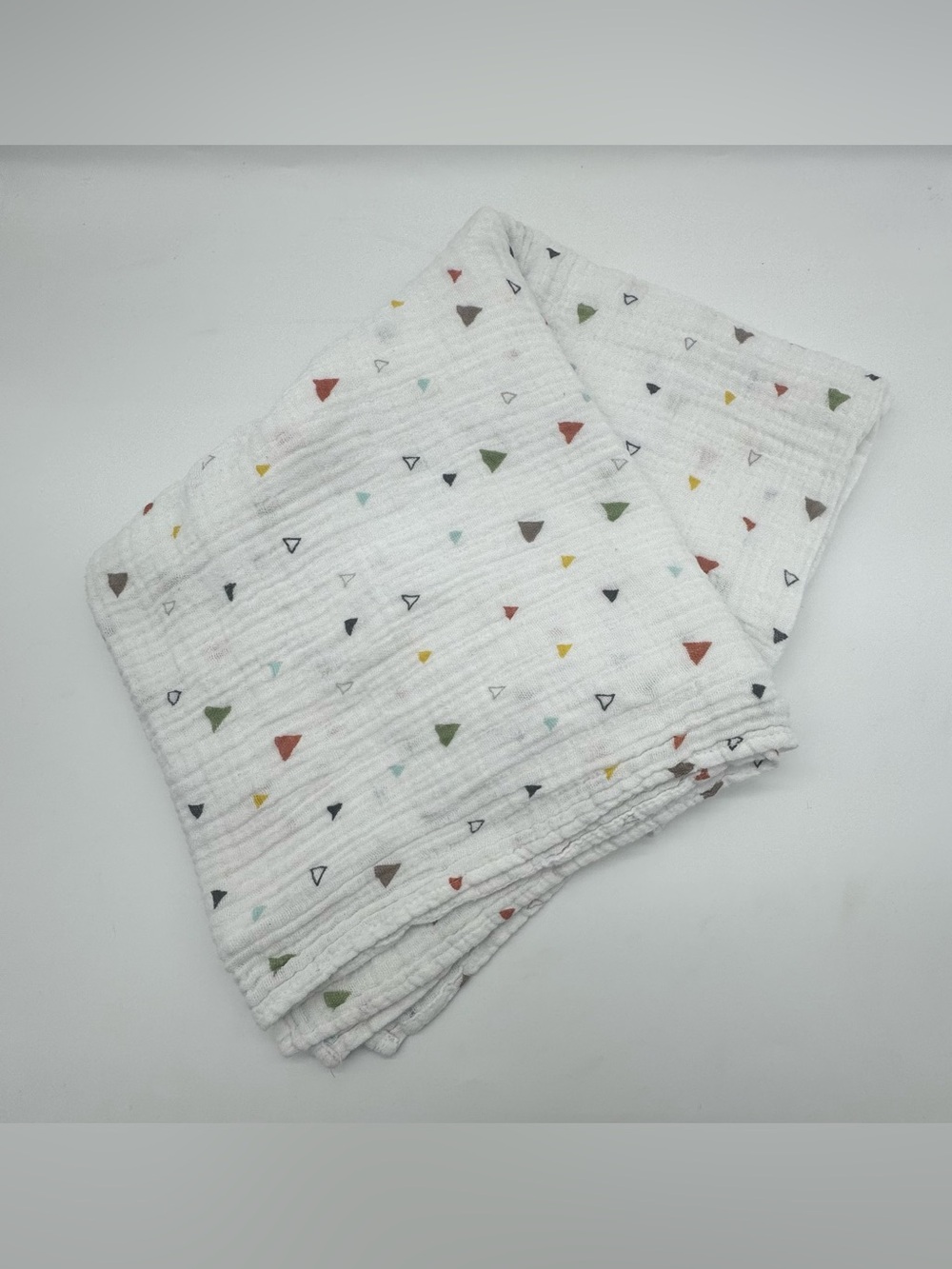 Little Unicorn Muslin Swaddle Blanket featuring Triangle and Tree Pattern